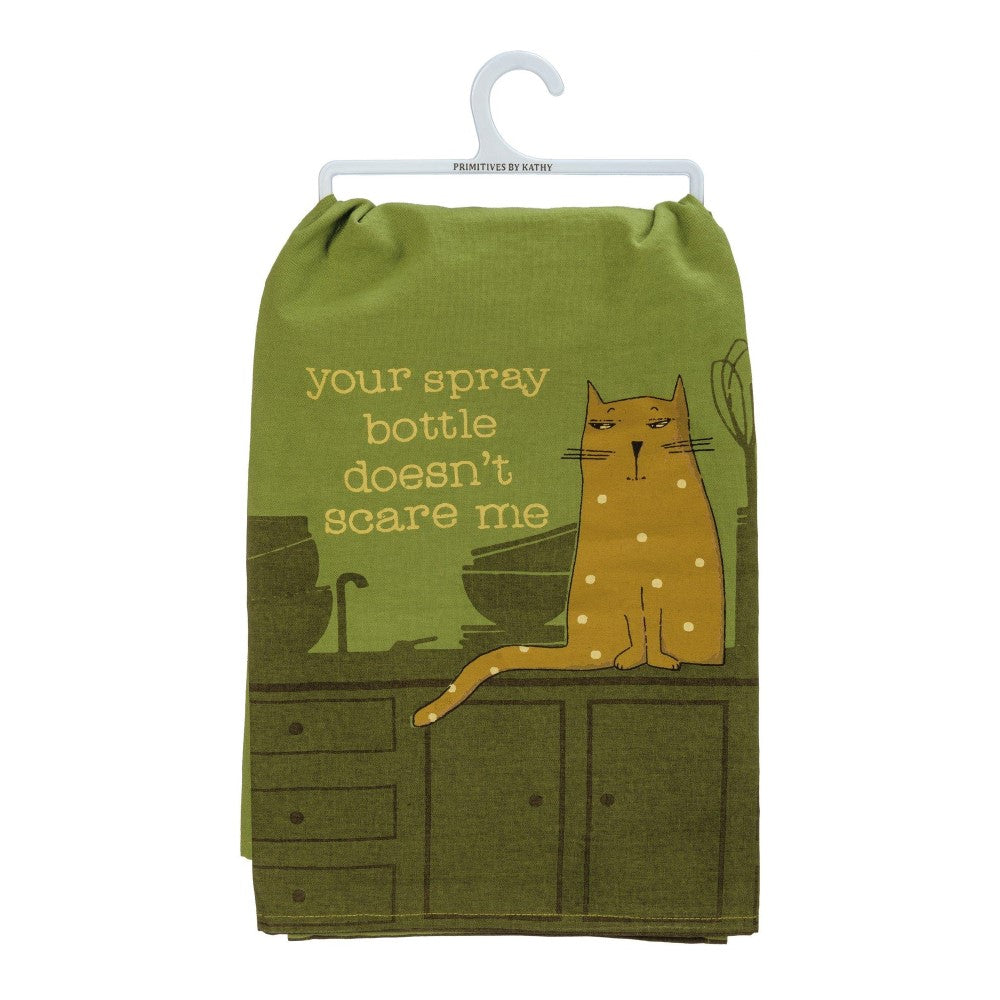 Green towel with a sassy cat illustration and text: "your spray bottle doesn't scare me."