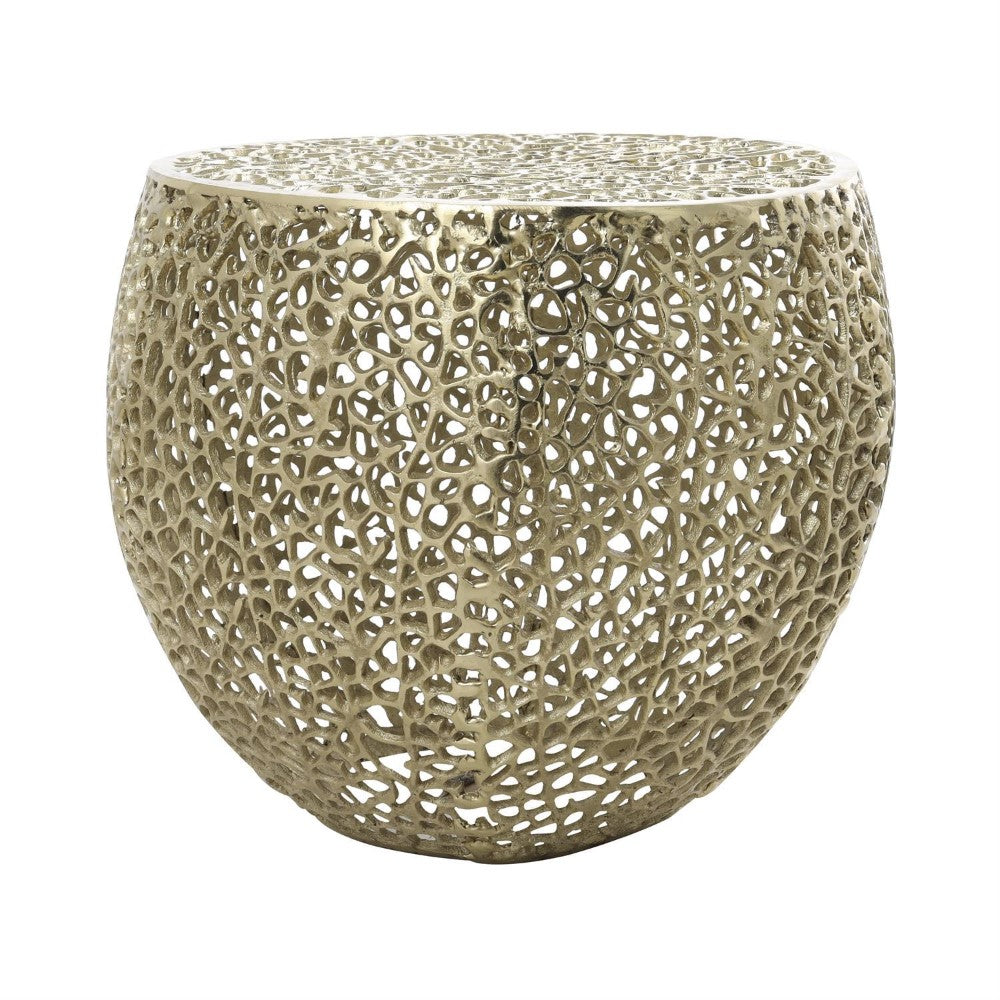 Ornate gold metal table with intricate lattice design.