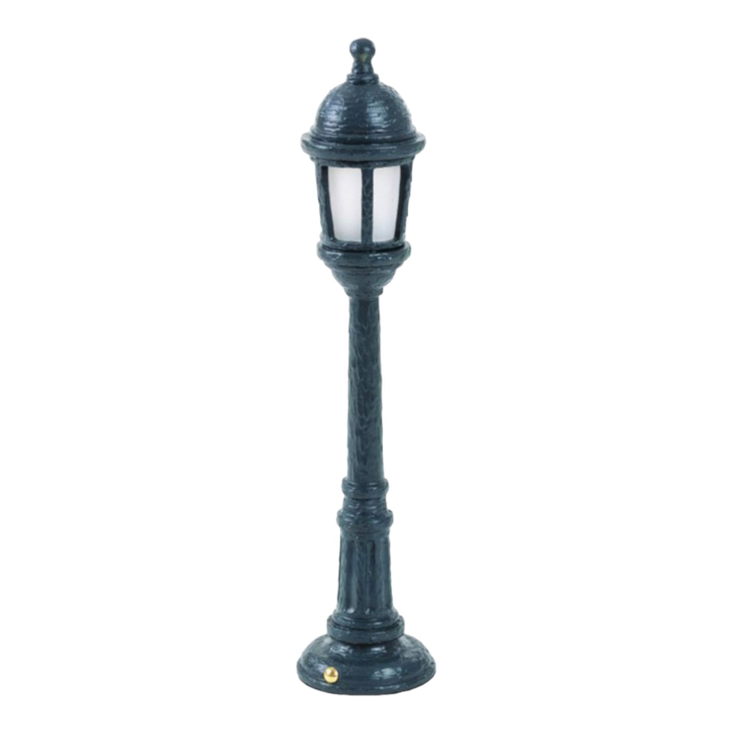 Miniature vintage-style lamp post on a white background.