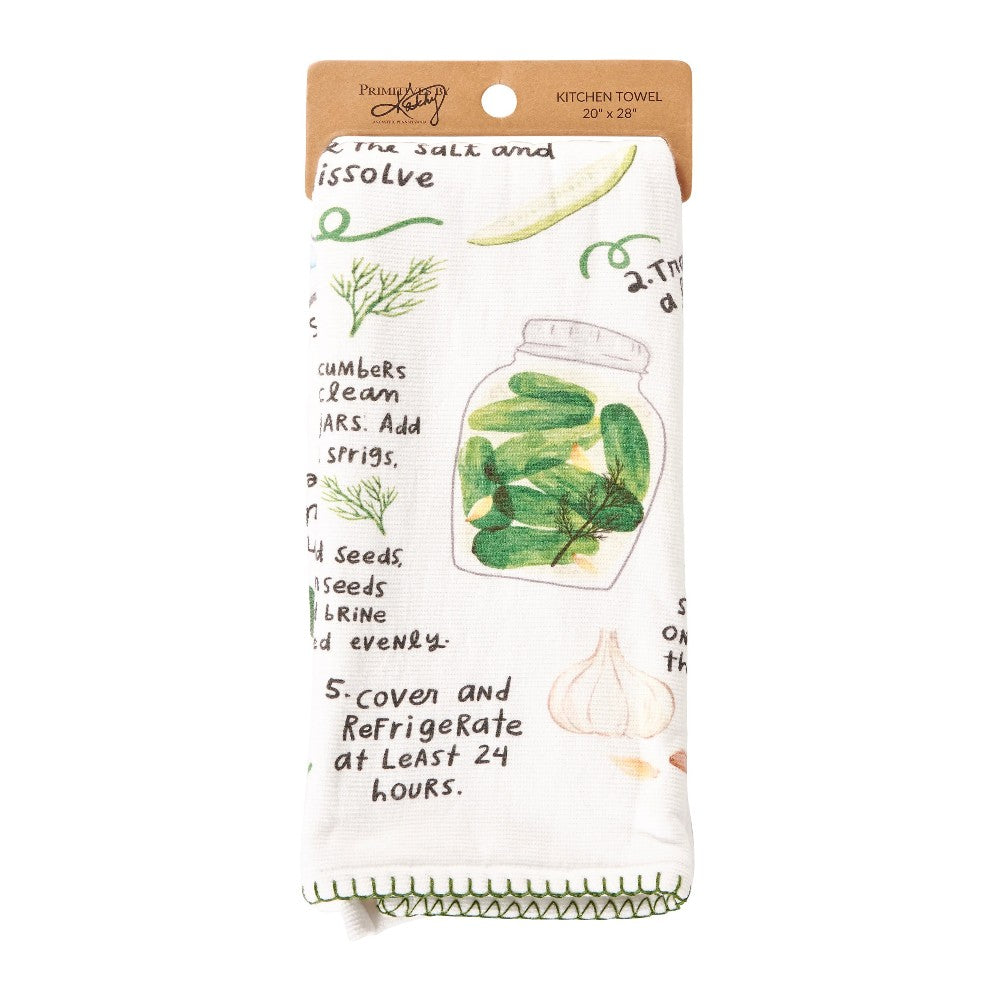 Kitchen towel with jar and herb illustrations, pickle recipe text.