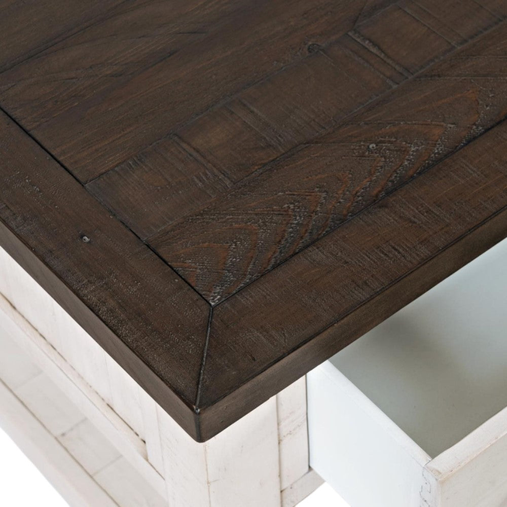 Wooden table corner with an open drawer.