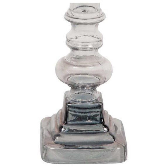 Glass candlestick base with ornate, geometric design.