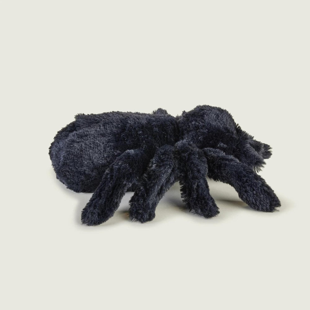 Plush black spider on a plain background.