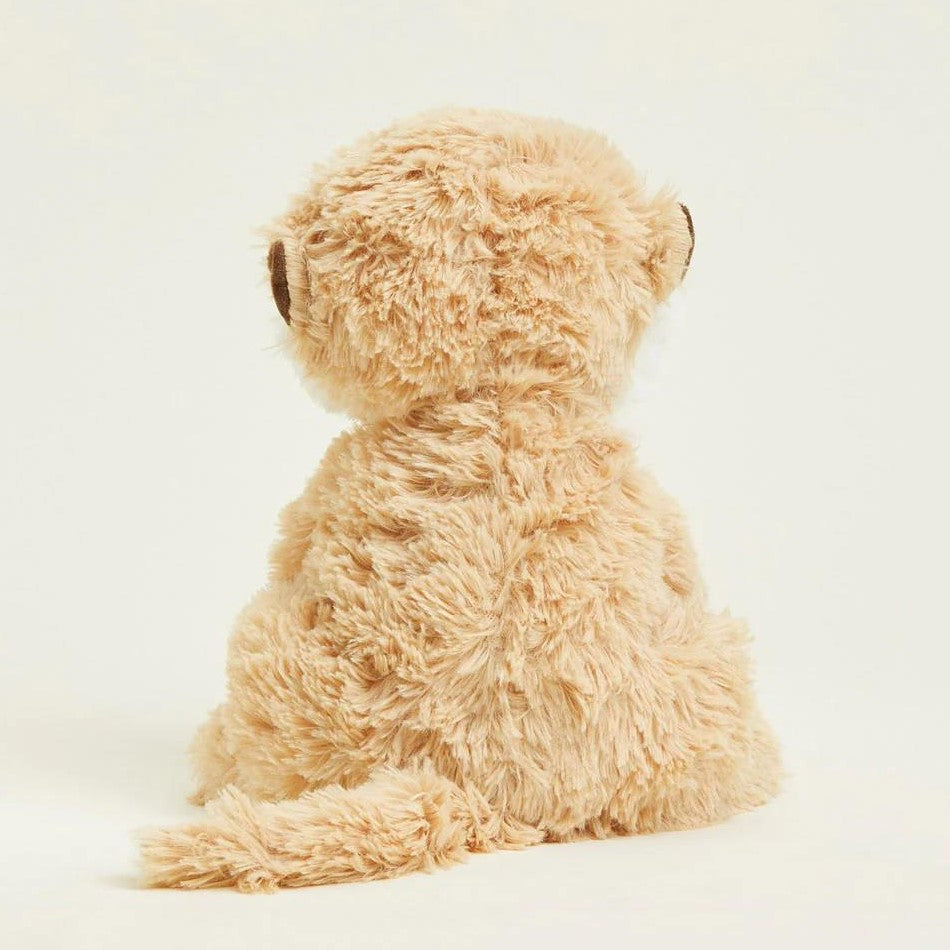 Fluffy stuffed animal sitting with its back turned.