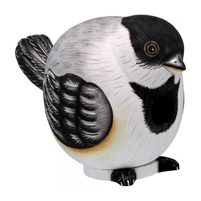 Bird-shaped birdhouse with black and white markings.
