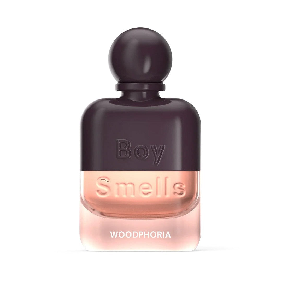 Perfume bottle labeled "Boy Smells Woodphoria" with dark cap.