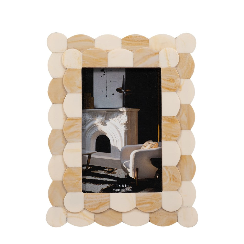 Elegant beige photo frame with geometric design and a fireplace image.
