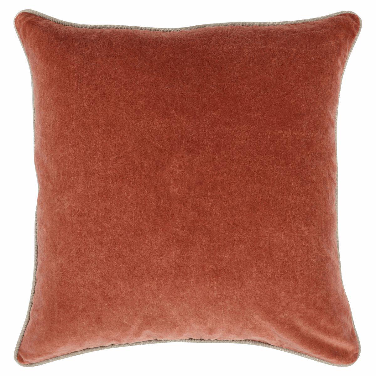 Square rusty orange velvet pillow with subtle piping trim.