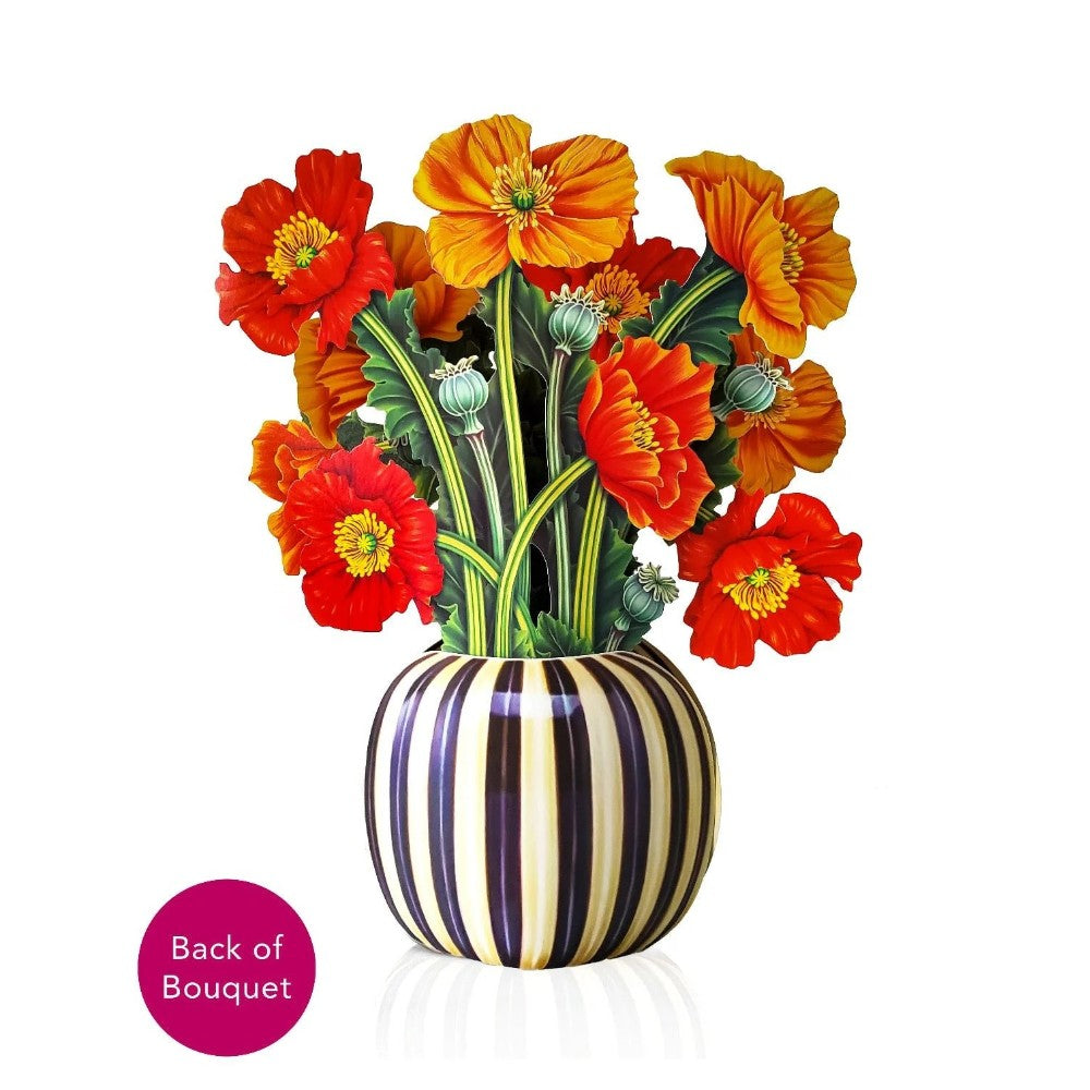 Striped vase with vibrant orange and red poppy flowers.