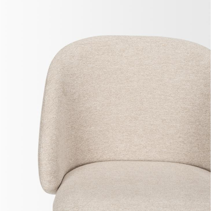 Beige upholstered chair with a rounded back.