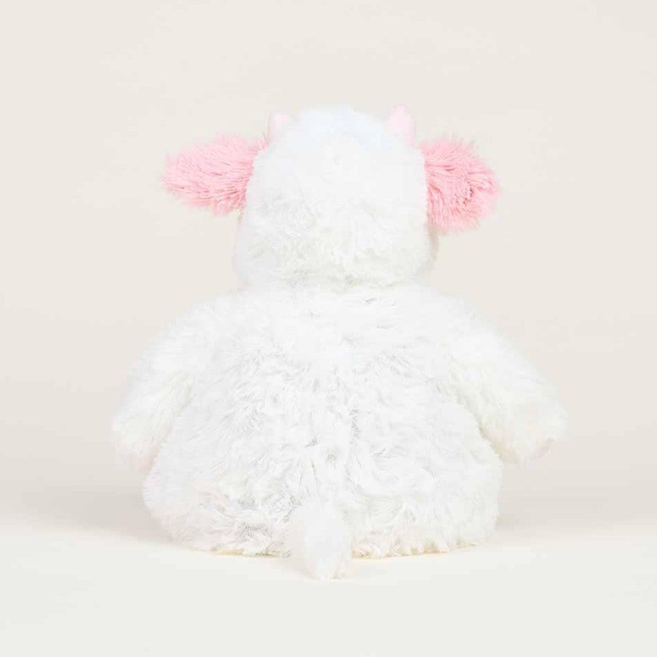 Fluffy white plush with pink ears facing away.