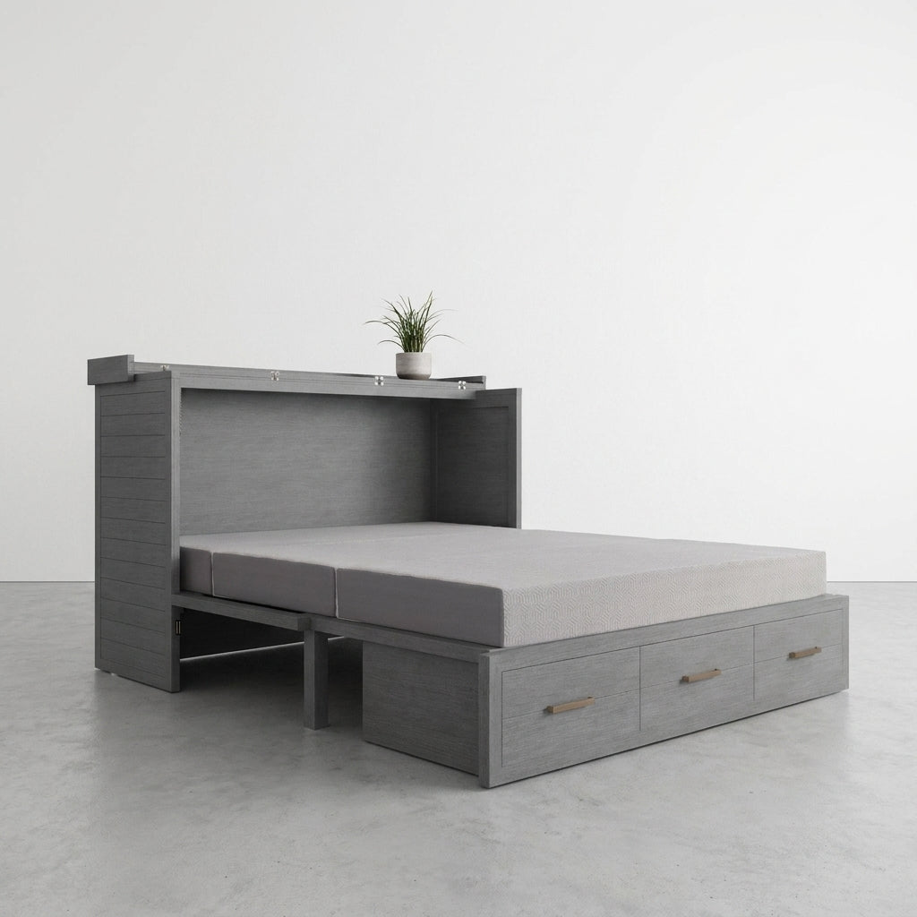 Grey murphy bed with drawers and a plant on top.
