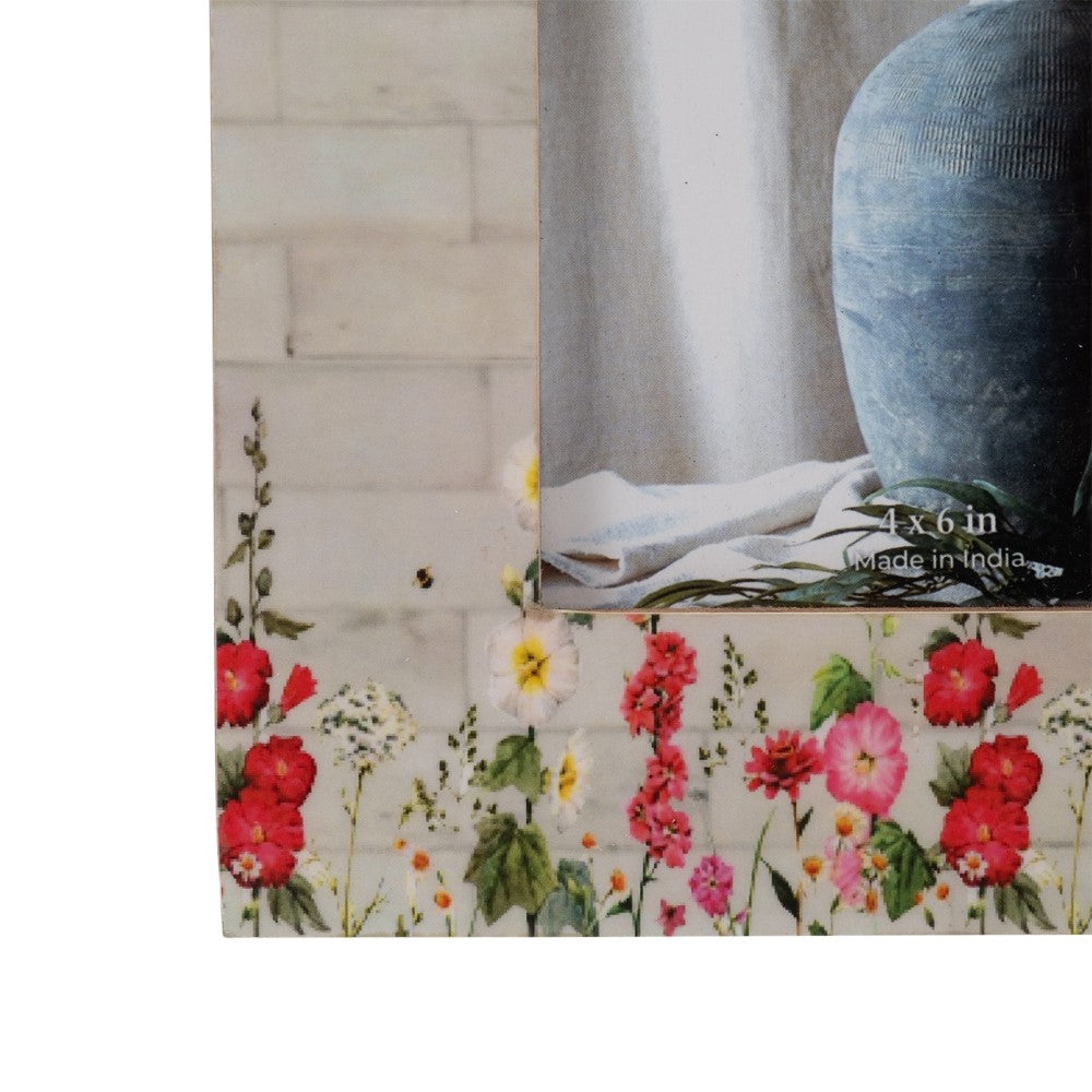 Floral frame with vase and cloth insert, size marked 4x6 in, Made in India.