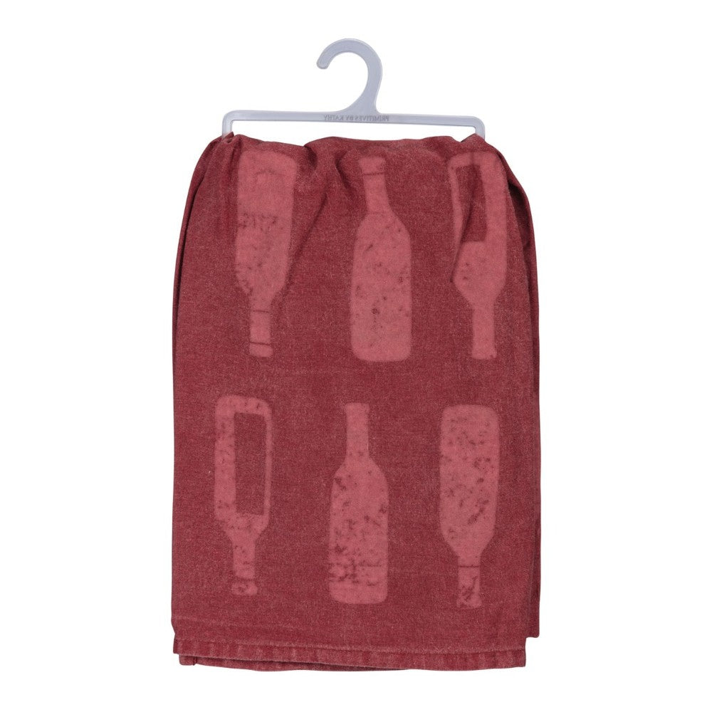 Red towel with bottle patterns hanging on a plastic hanger.