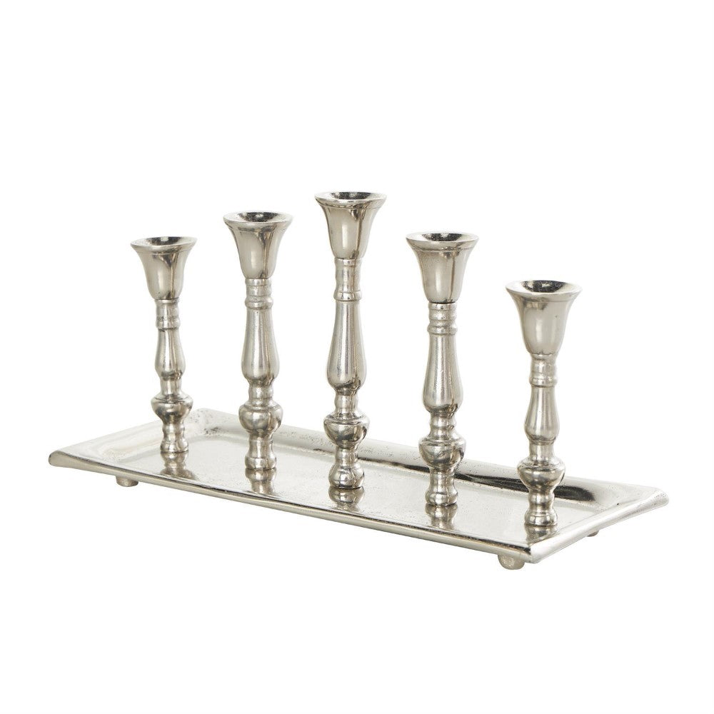 Silver five-candle holder with a rectangular base.