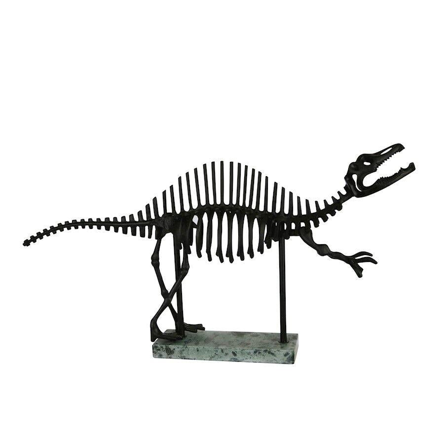 Metal dinosaur skeleton model on a stand.