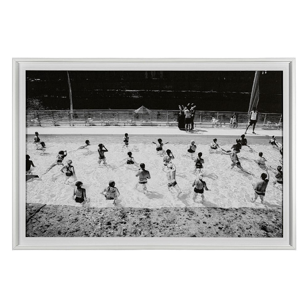 Black and white photo of children playing in a swimming pool.
