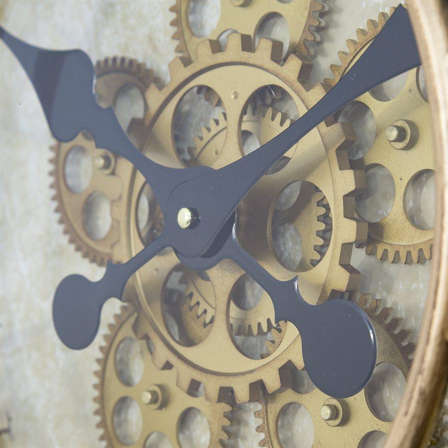 Close-up of clock gears and hands in black and gold.