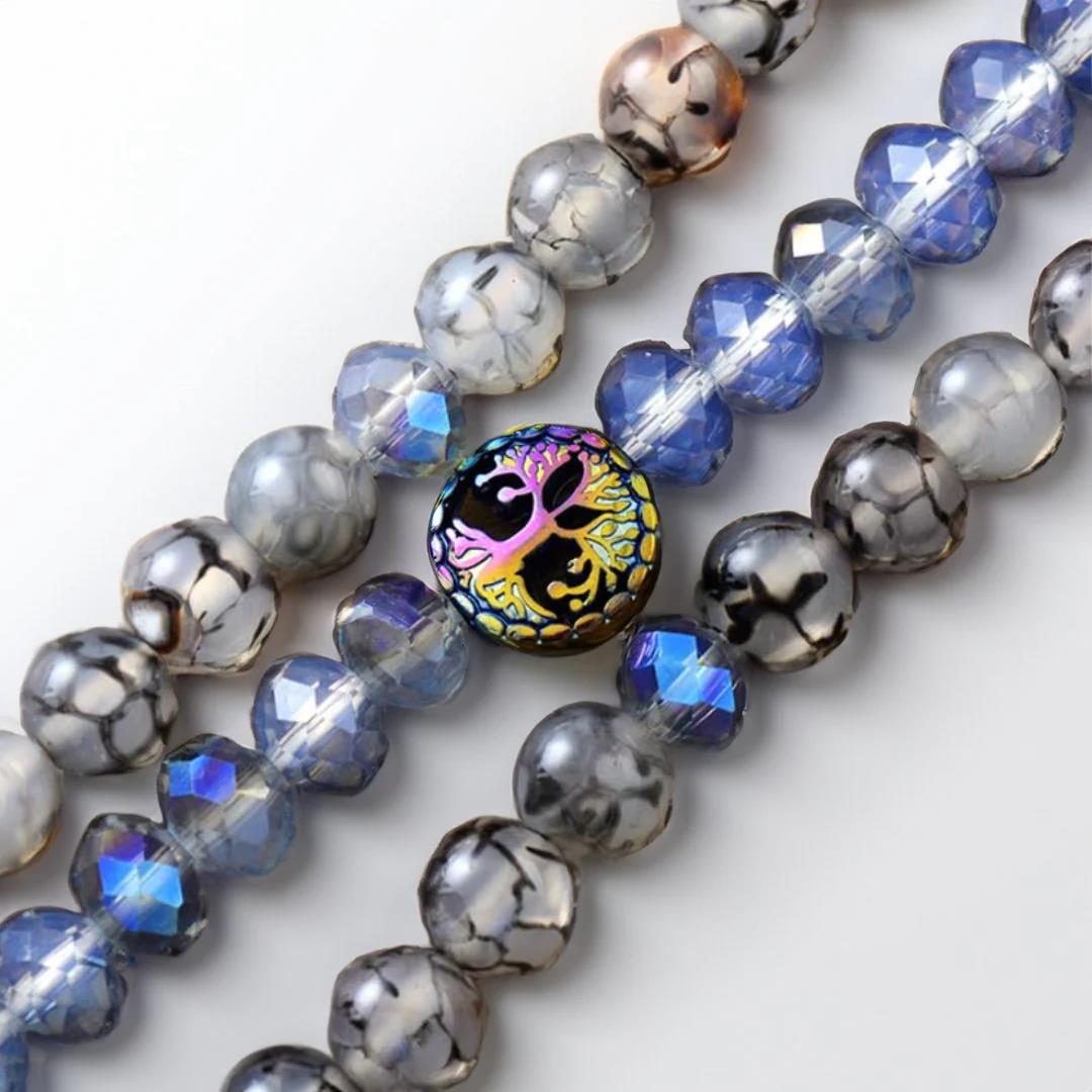 Colorful beads with a tree design on one central bead.