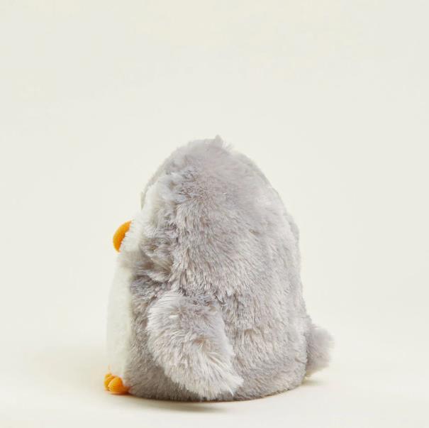 Fluffy gray and white plush penguin toy seen from the back.