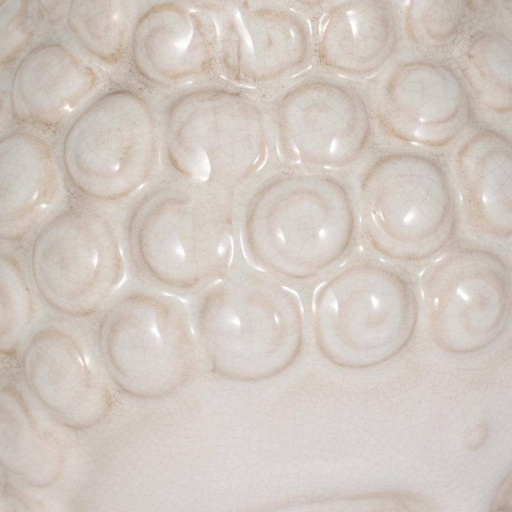 White textured ceramic surface with circular patterns.