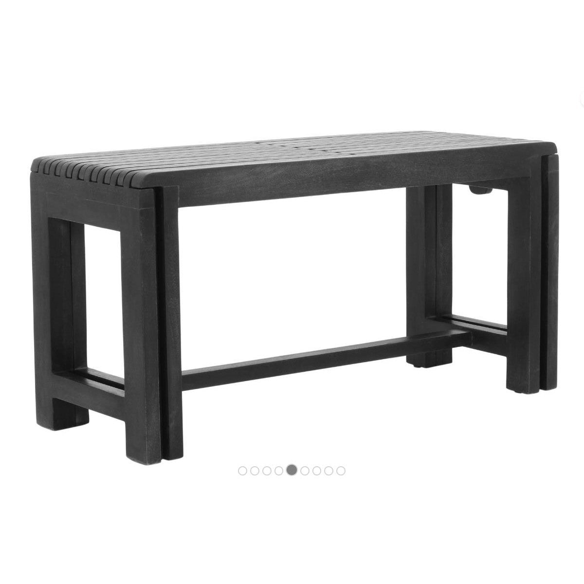 Black plastic bench with a slatted seat design.