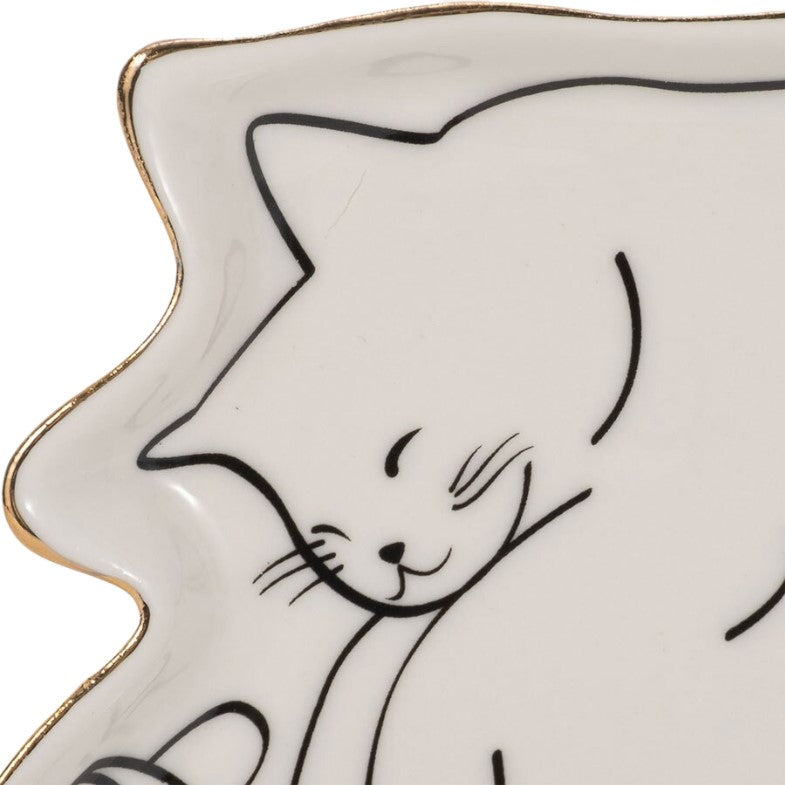 Cat drawing on wavy ceramic plate with gold edges.