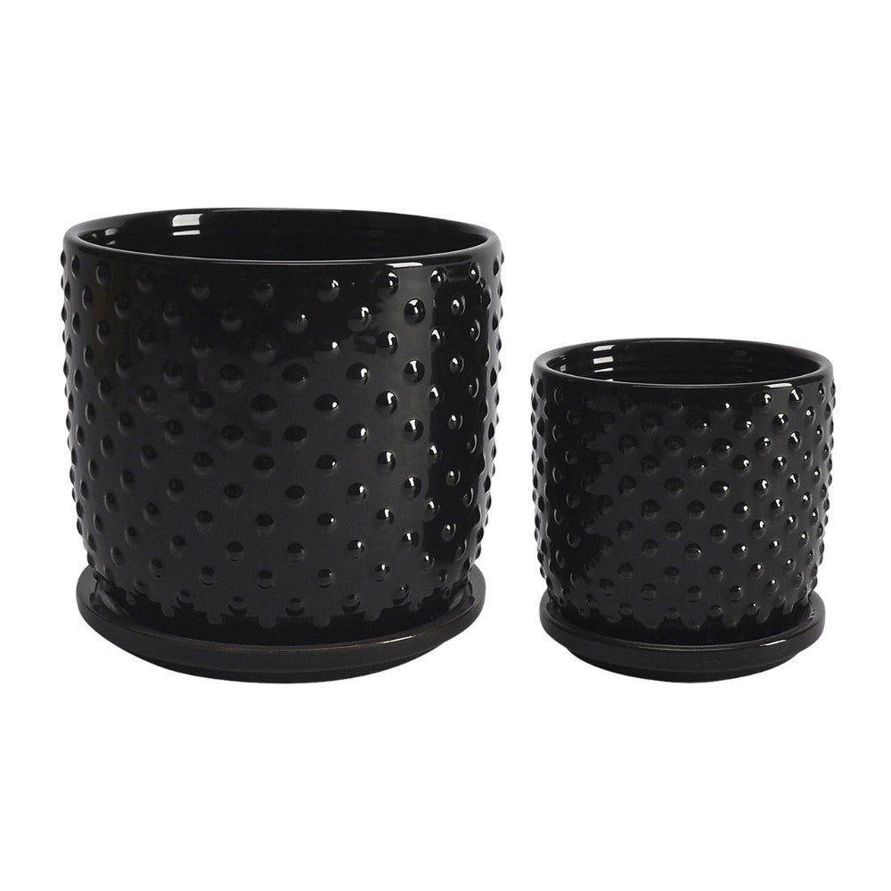 Two black textured flower pots, one larger than the other.