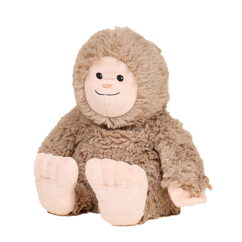 Cute, fluffy plush toy with a smiling face and big feet.