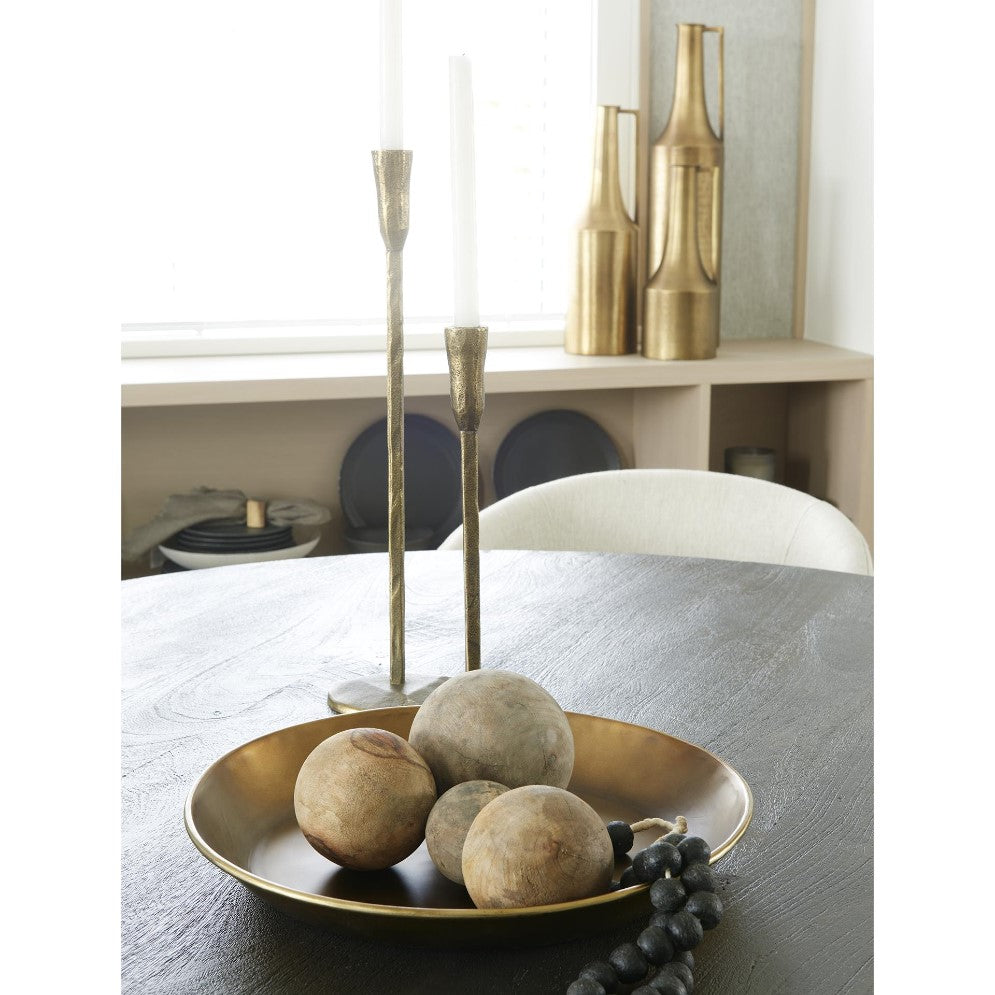 Candles and decorative balls on a dining table.