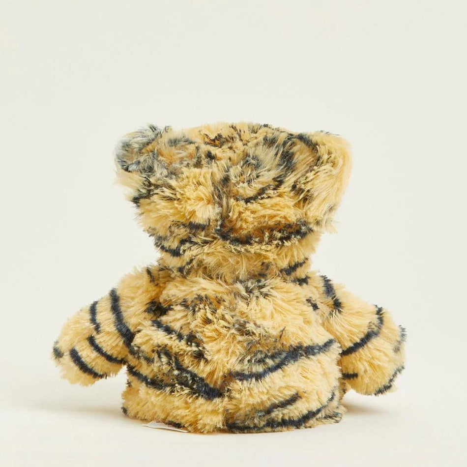 Fluffy tiger-striped teddy bear facing backward.