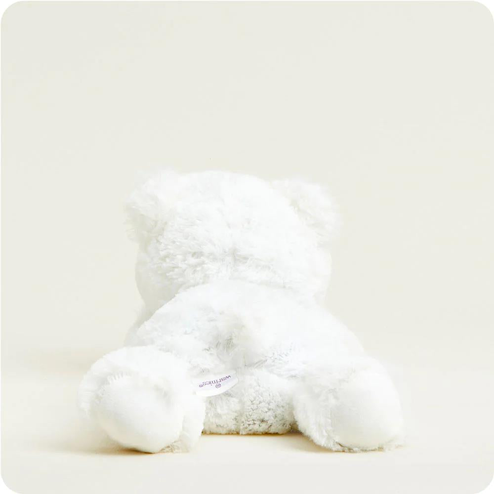 Fluffy white teddy bear facing away.