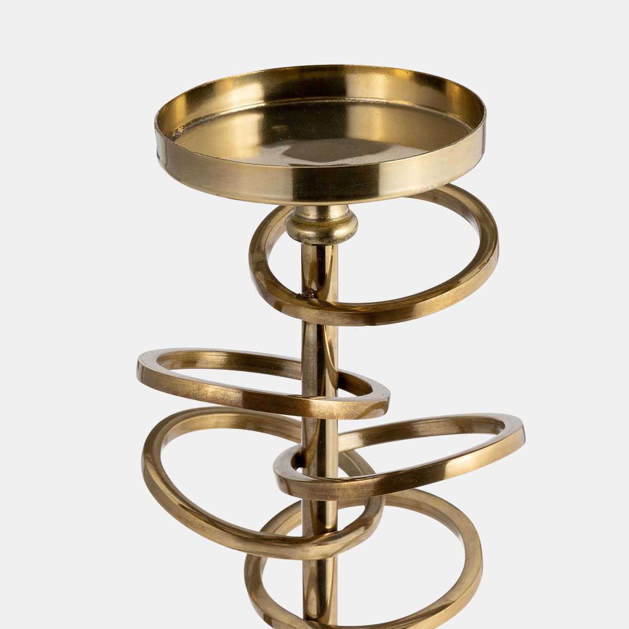 Gold spiral candlestick holder on white background.
