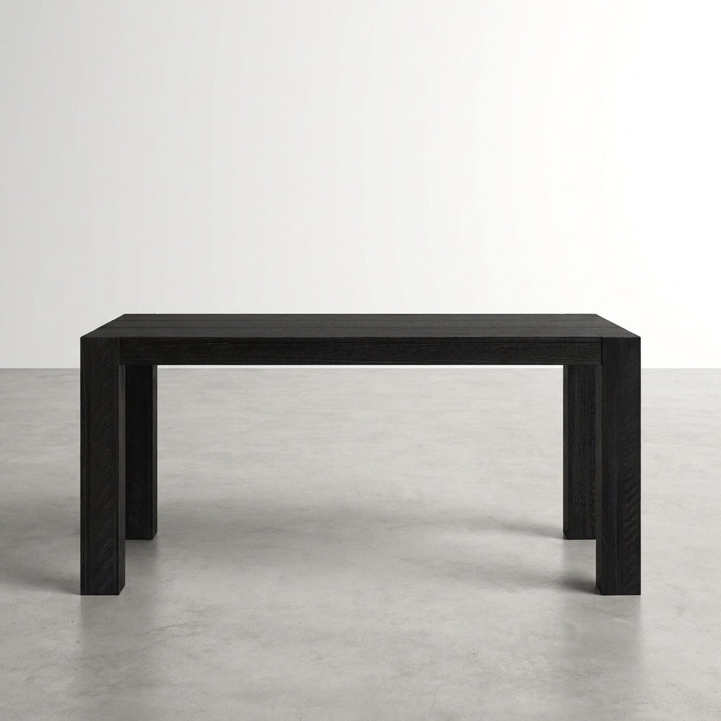 Black rectangular table on a gray floor.