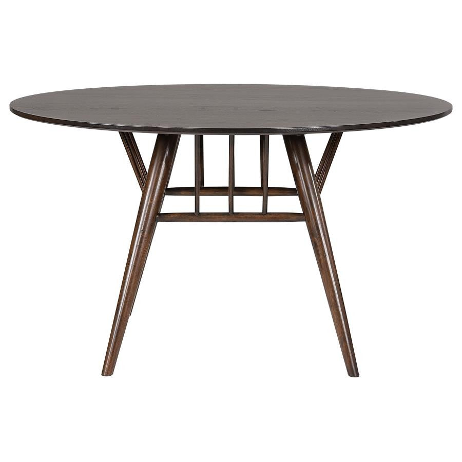 Round mid-century wooden table with angled legs.
