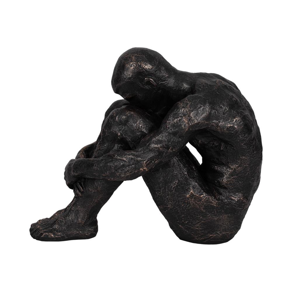 Bronze sculpture of a seated, contemplative figure.