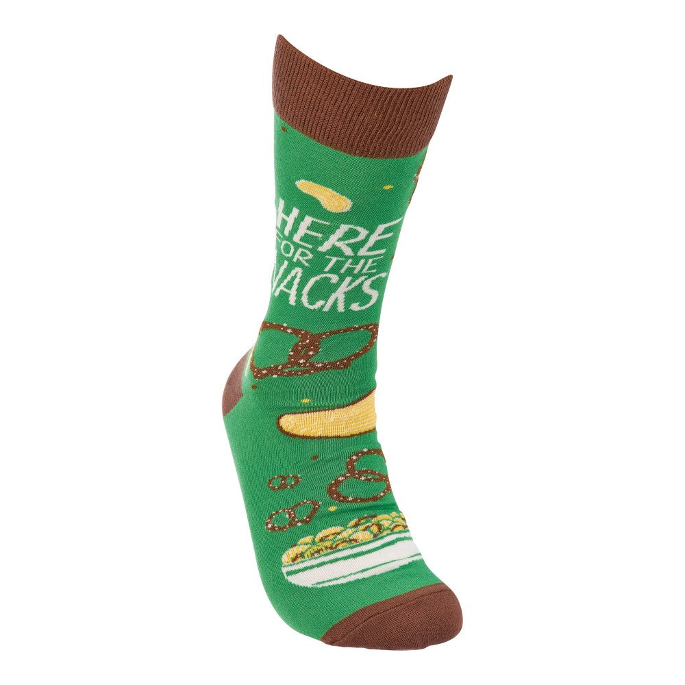 Green sock with snack designs and "Here for the snacks" print.