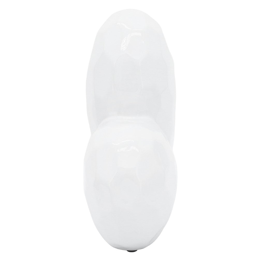 White geometric shaped ceramic object, glossy surface.
