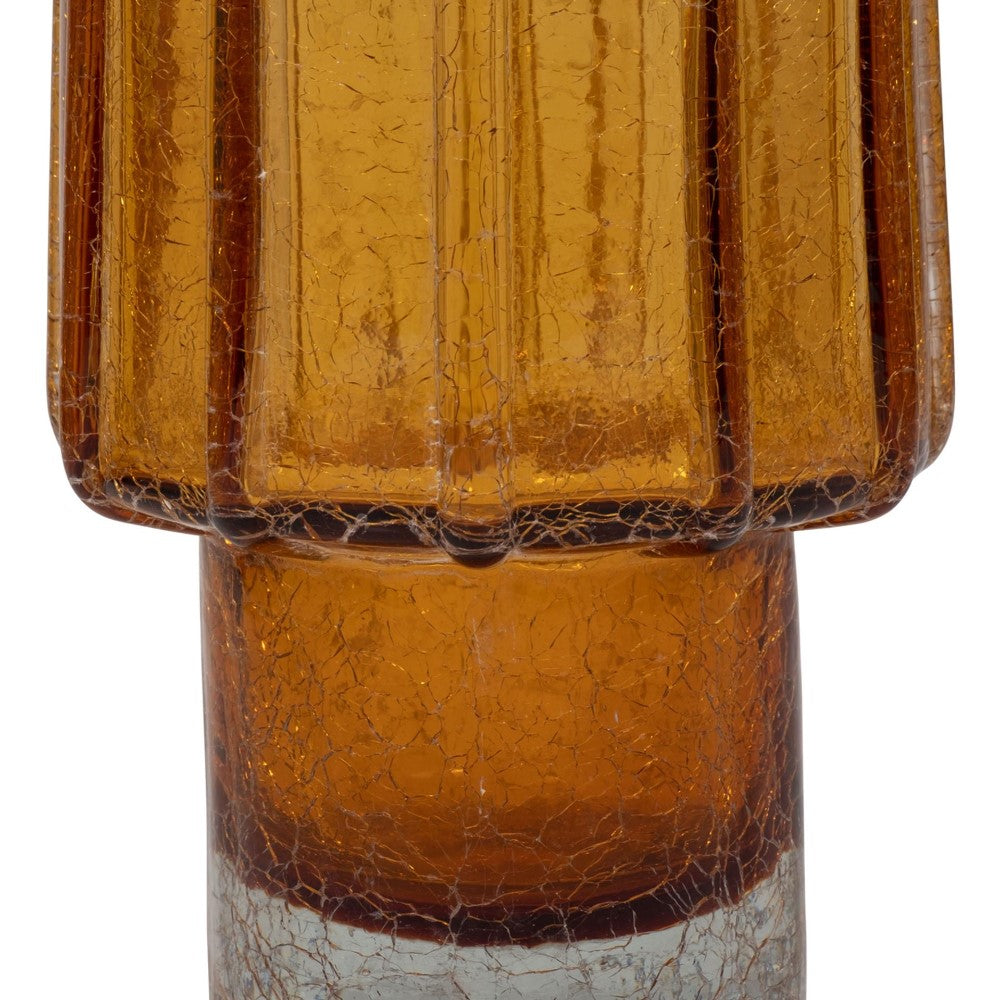 Amber ribbed glass with textured surface, close-up.