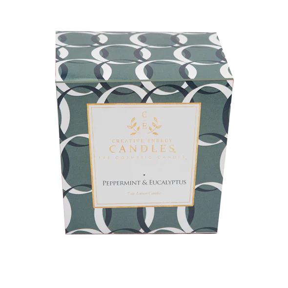 Green patterned candle box labeled "Peppermint & Eucalyptus."