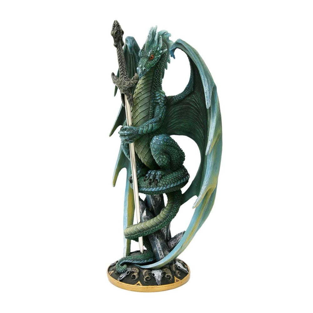 Green dragon statue holding a sword on circular base.