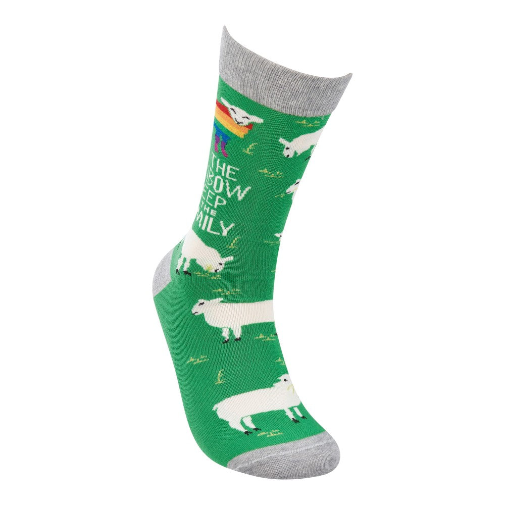 Green sock with sheep and rainbow patterns.