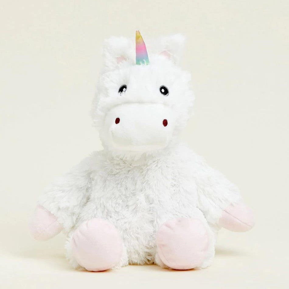 Fluffy unicorn plush with a rainbow horn.