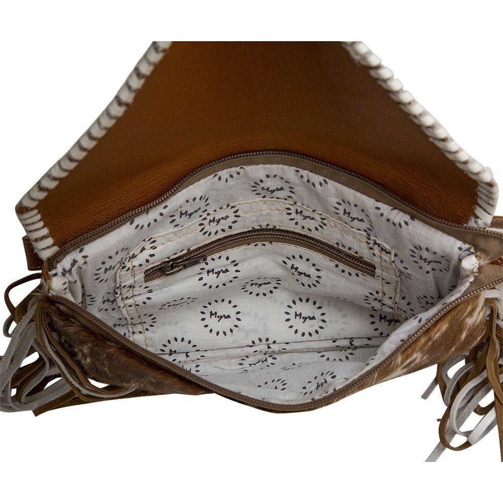 Brown purse with printed interior lining and zipper pocket.