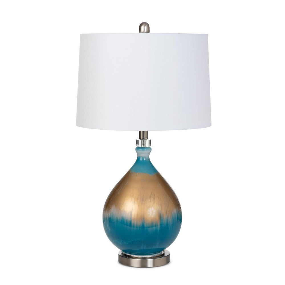 Elegant lamp with blue and gold base, white shade.