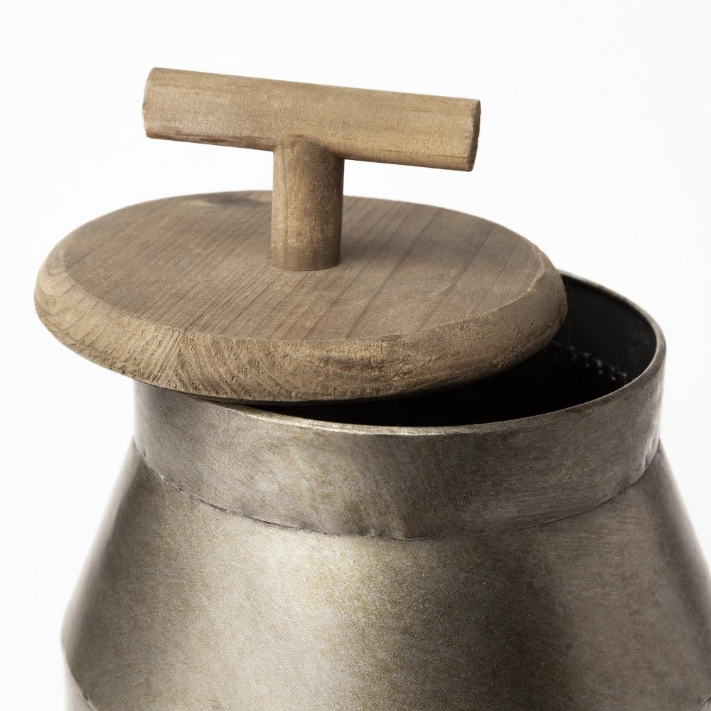 Metal container with a wooden lid partially open.