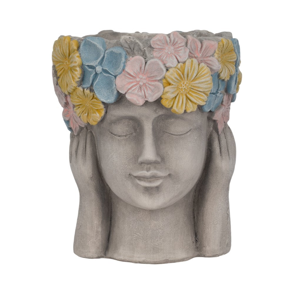 Stone head planter with closed eyes and colorful flower crown.