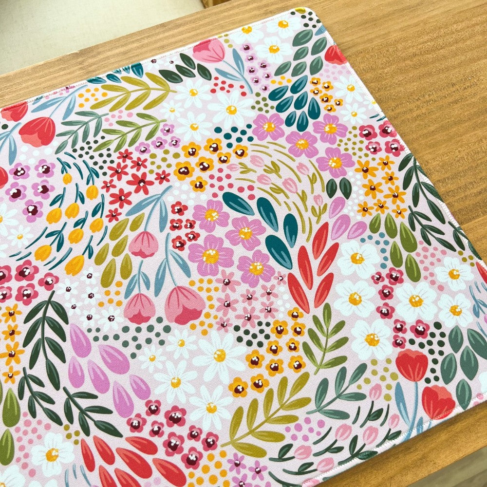 Colorful floral pattern on a wooden surface.