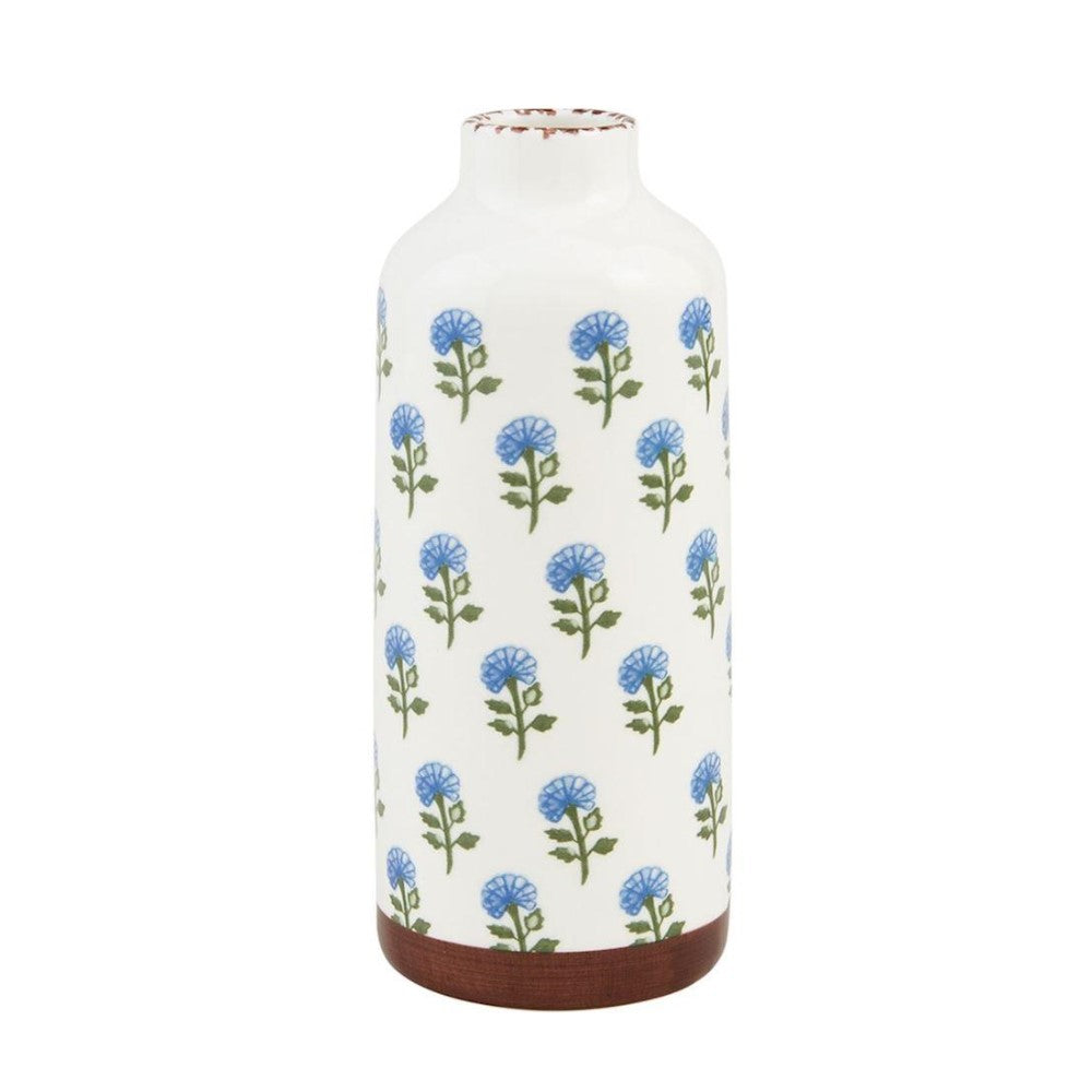 White vase with blue flower pattern and brown base.