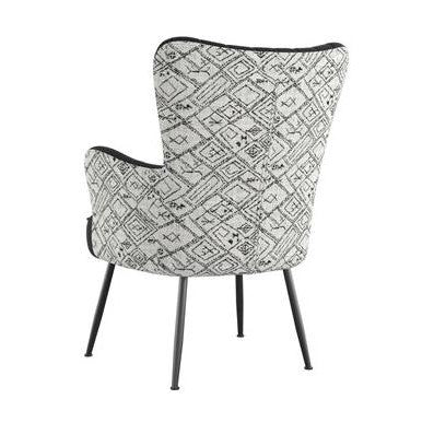 Geometric-patterned chair with black slim legs, viewed from the back.